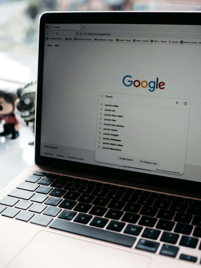 pexels photo 16368540 16368540 A close-up shot of a laptop displaying a Google search page with related searches visible.